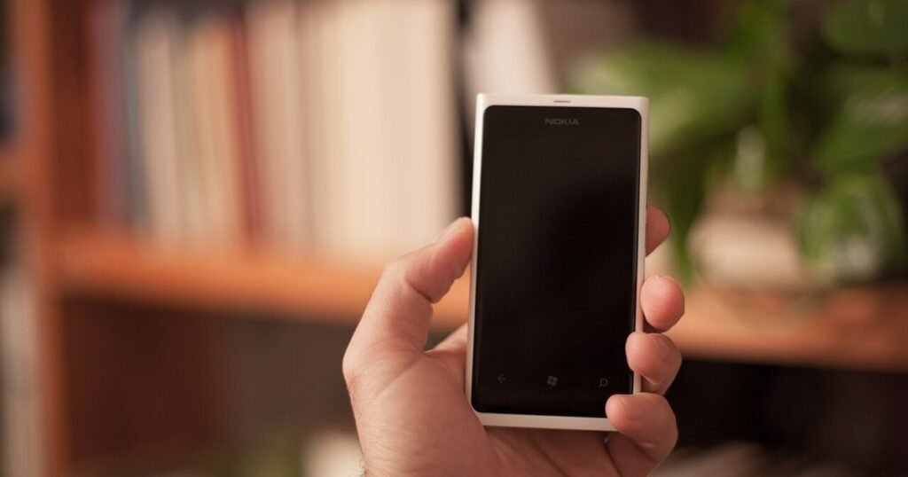 Person using a smartphone, illustrating Android Private Space and phone privacy settings