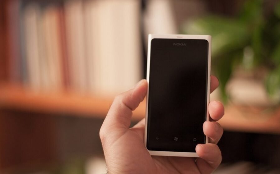 Person using a smartphone, illustrating Android Private Space and phone privacy settings