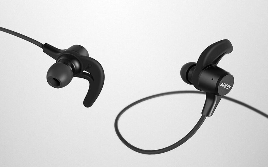 Pair of black wireless earbuds on a white background