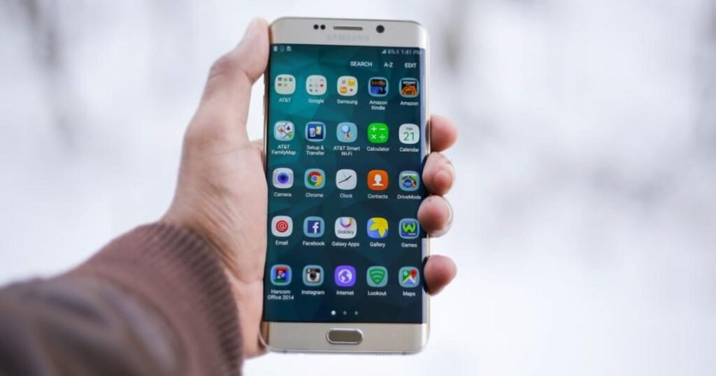 A Samsung Galaxy phone held in hand while reviewing privacy settings