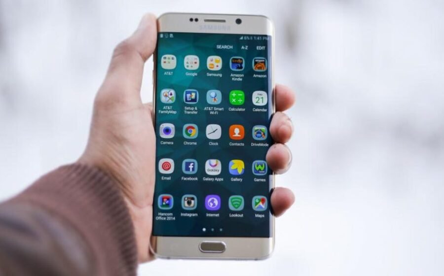 A Samsung Galaxy phone held in hand while reviewing privacy settings