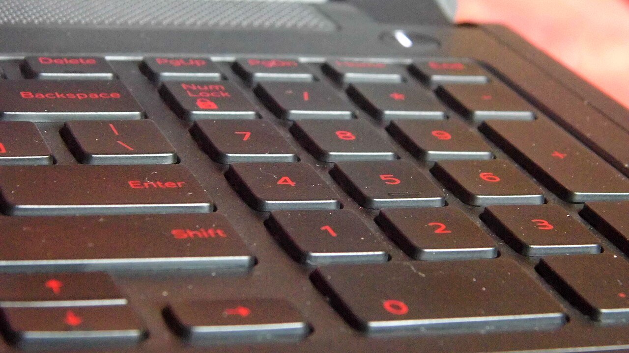 Close-up of a backlit laptop keyboard, the part of a machine you cannot upgrade later