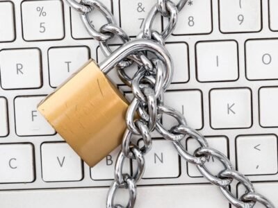 Padlock and chain over a keyboard, used to illustrate password manager security