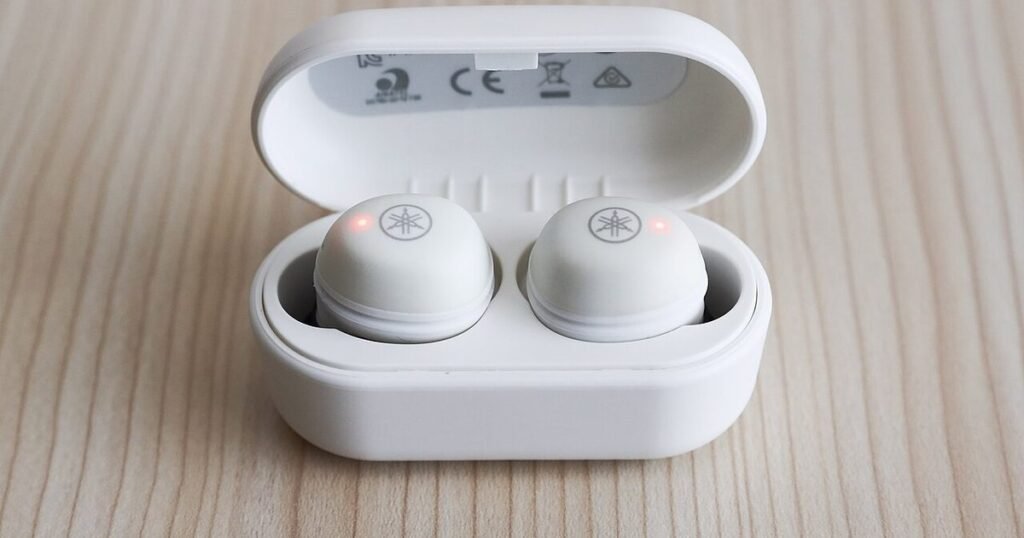 Wireless earbuds in a charging case