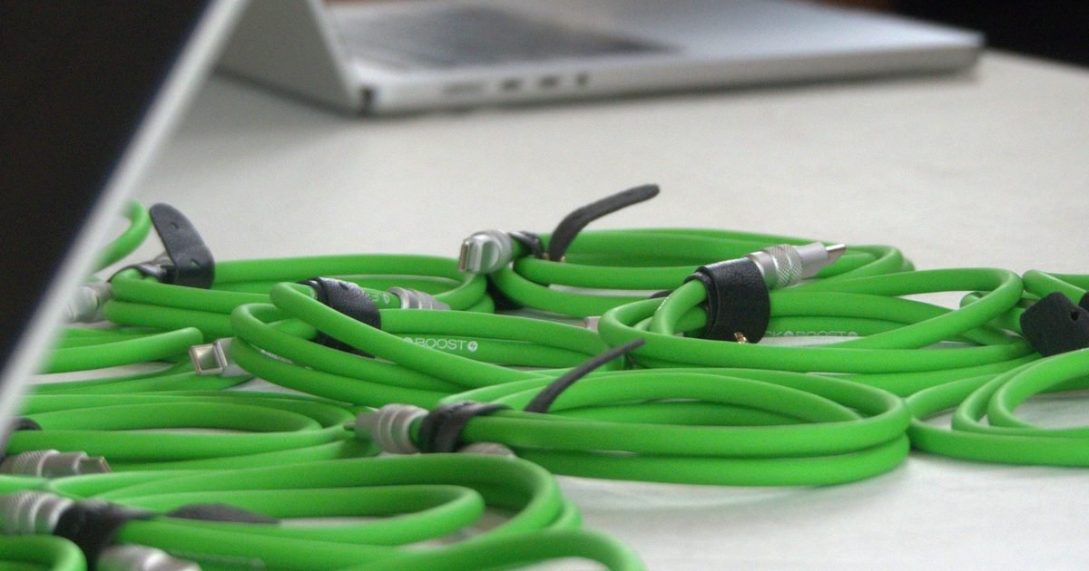 Green USB-C cables on a desk for a cable quality and dock troubleshooting section